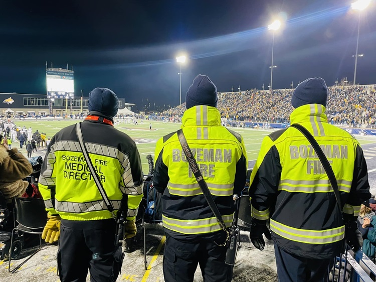 MSU Playoffs football with medical director and firefighters standing by