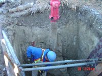 Worker fixing a water line